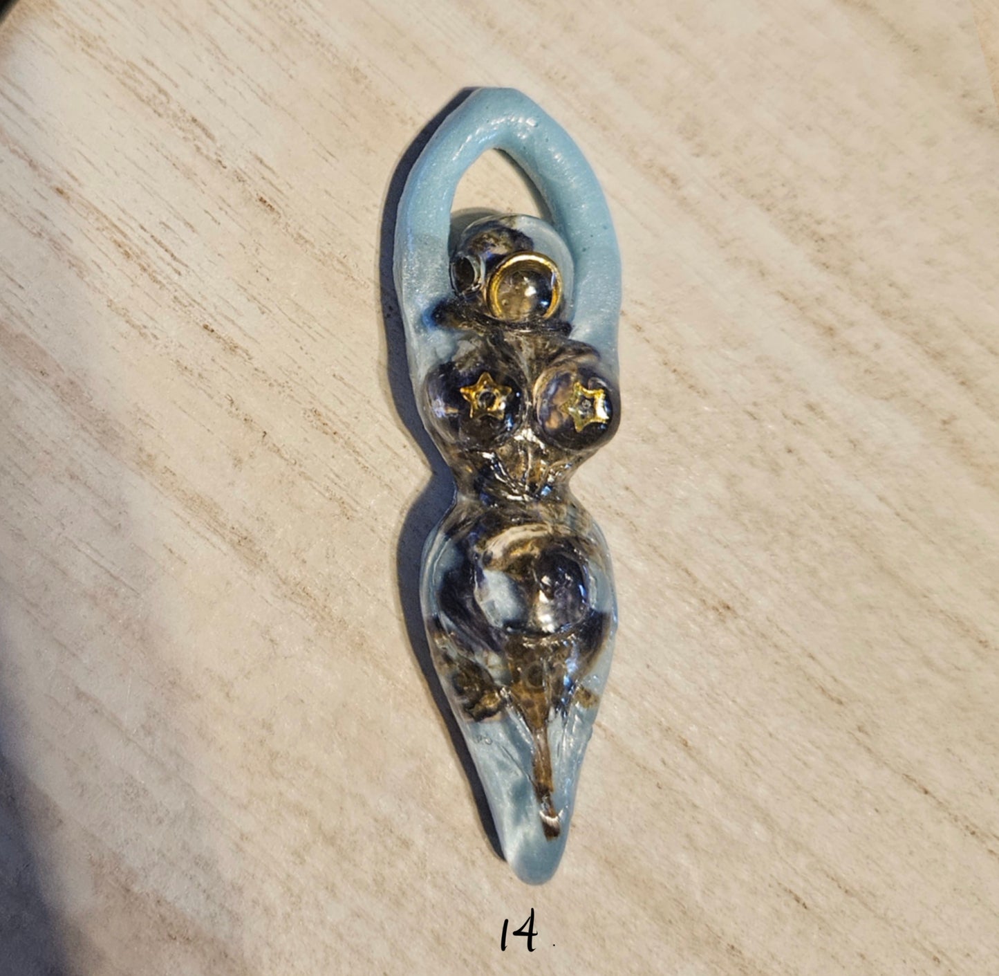 Tiny goddess figurine