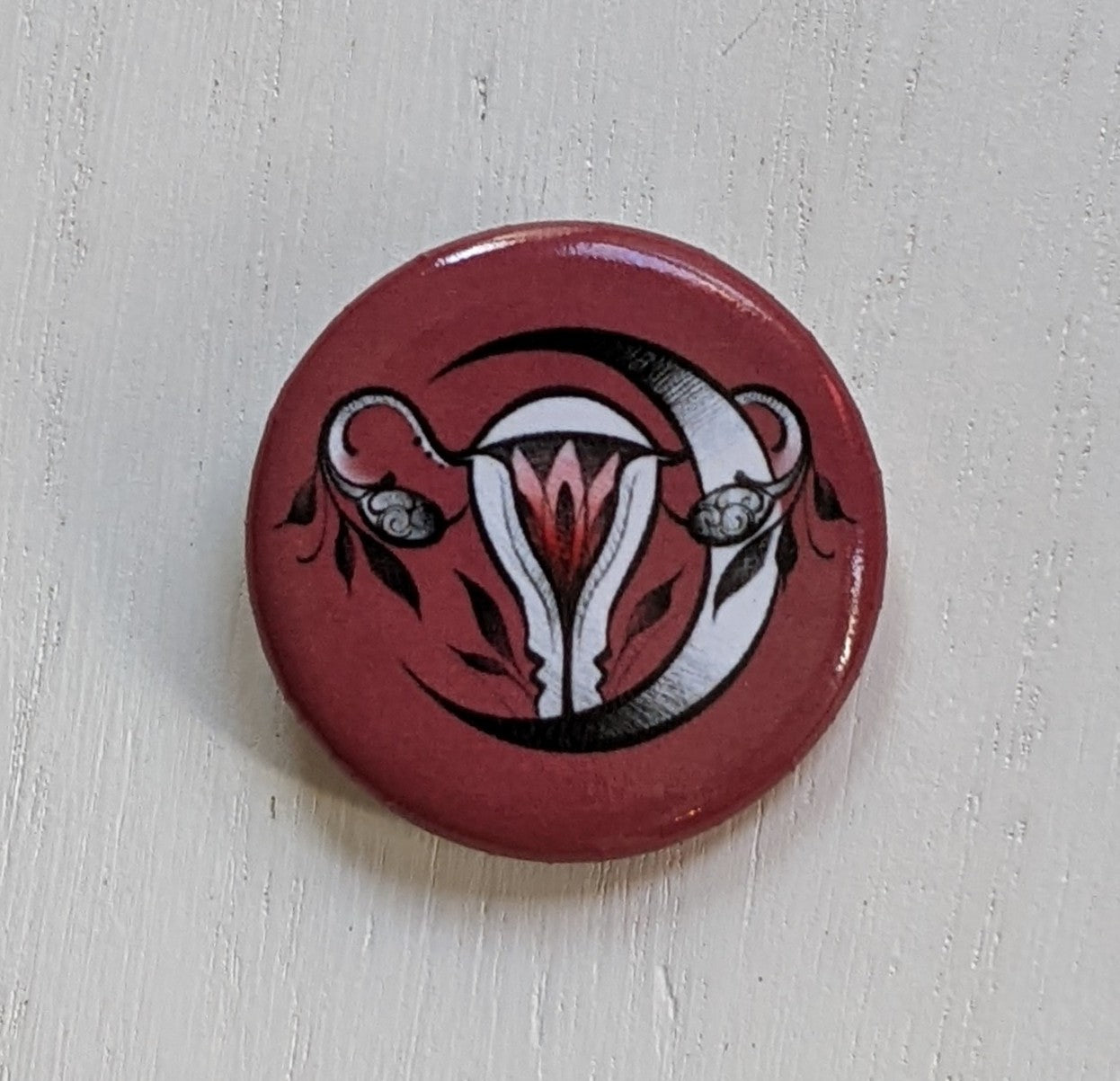 Uterus pin buttons